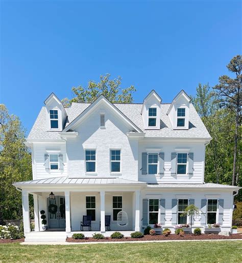 blue house white metal roof|white house navy blue shutters.